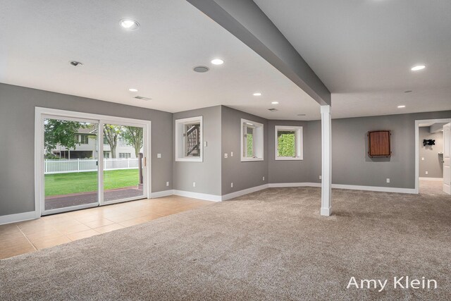 1657 N Bay Dr, Hudsonville, MI 49426 - unfurnished living room featuring carpet flooring, healthy amount of natural light, recessed lighting, and baseboards