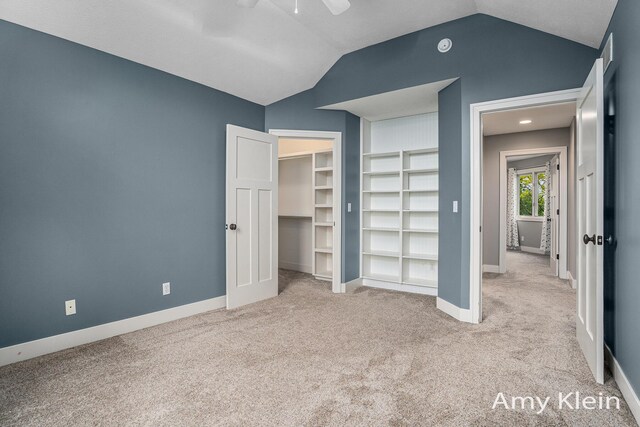 1657 N Bay Dr, Hudsonville, MI 49426 - unfurnished bedroom with lofted ceiling, carpet flooring, baseboards, a ceiling fan, and a closet
