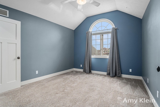 1657 N Bay Dr, Hudsonville, MI 49426 - spare room with ceiling fan, carpet, vaulted ceiling, and baseboards