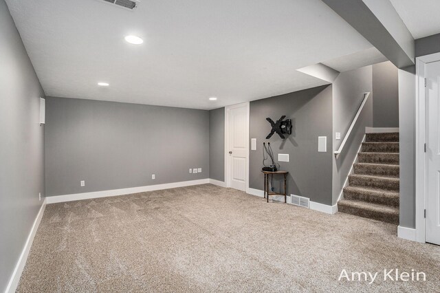 1657 N Bay Dr, Hudsonville, MI 49426 - finished below grade area featuring carpet flooring, baseboards, recessed lighting, and stairs