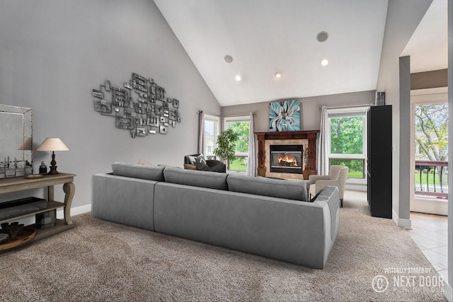 1657 N Bay Dr, Hudsonville, MI 49426 - living room featuring light colored carpet, a tile fireplace, baseboards, recessed lighting, and high vaulted ceiling