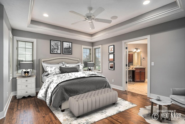 1657 N Bay Dr, Hudsonville, MI 49426 - bedroom featuring a raised ceiling, wood-type flooring, baseboards, recessed lighting, and connected bathroom