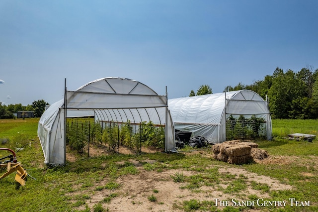 18619 130th Ave, Fruitport, MI 49415 - view of yard featuring a greenhouse and an outdoor structure