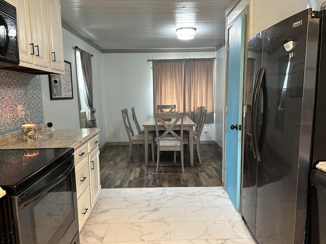 3092 S M 37, Baldwin, MI 49304 - kitchen featuring black appliances, light marble finish flooring, light countertops, baseboards, and wooden ceiling