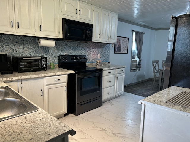 3092 S M 37, Baldwin, MI 49304 - kitchen featuring black appliances, light countertops, light marble finish floors, white cabinetry, and a sink