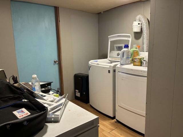 3092 S M 37, Baldwin, MI 49304 - washroom featuring washer and clothes dryer and light wood-type flooring