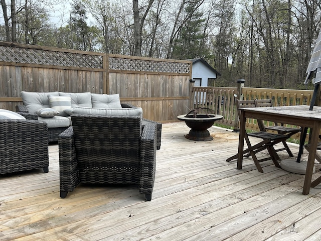 3092 S M 37, Baldwin, MI 49304 - deck with an outdoor living space with a fire pit and outdoor dining area
