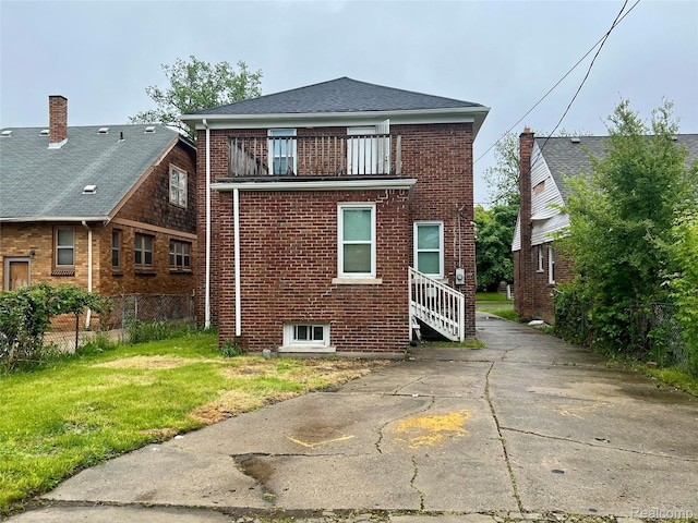 8887 Sorrento St, Detroit, MI 48228 - back of property with a balcony and brick siding