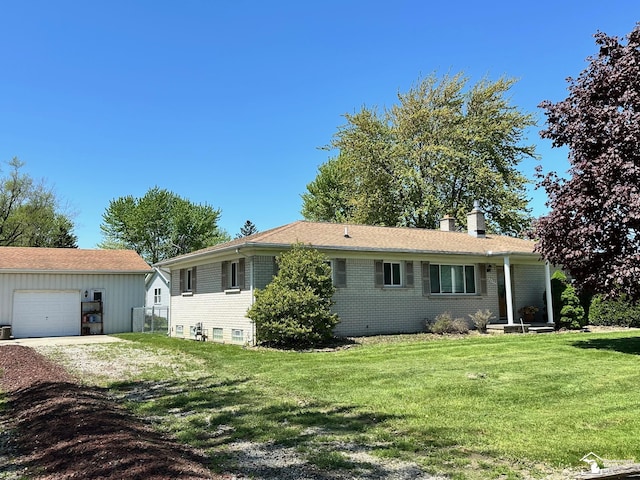 8499 Armstrong Rd, Newport, MI 48166 - ranch-style house with a chimney, a front yard, brick siding, and driveway