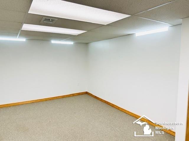 8499 Armstrong Rd, Newport, MI 48166 - finished basement with carpet flooring, a drop ceiling, and baseboards