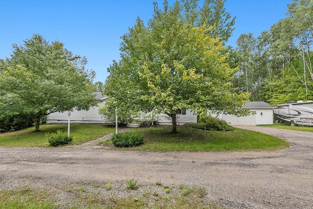 11478 E 7 Mile Rd, Tustin, MI 49688 - obstructed view of property featuring driveway