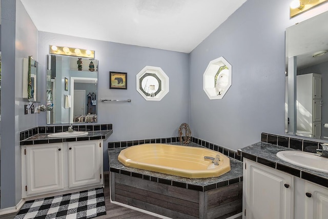 11478 E 7 Mile Rd, Tustin, MI 49688 - full bath with two vanities and a bath