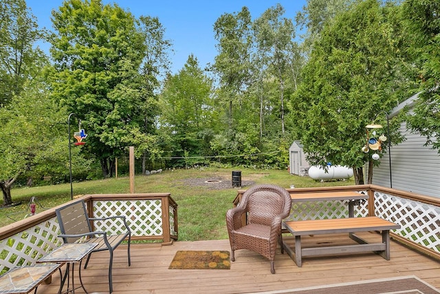 11478 E 7 Mile Rd, Tustin, MI 49688 - wooden terrace with a yard and view of wooded area