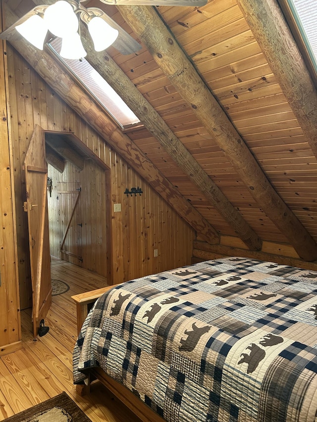 14278 Tyson Trl, Camden, MI 49232 - bedroom with wooden ceiling, wood-type flooring, wooden walls, and a skylight