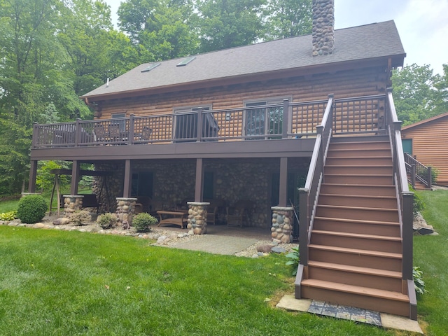 14278 Tyson Trl, Camden, MI 49232 - back of property featuring a wooden deck, stairs, a yard, a patio area, and a shingled roof