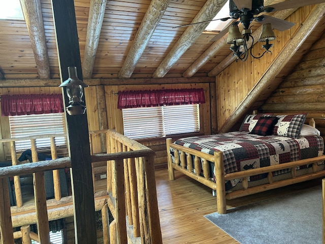 14278 Tyson Trl, Camden, MI 49232 - bedroom with rustic walls, light wood finished floors, and wooden ceiling with exposed beams