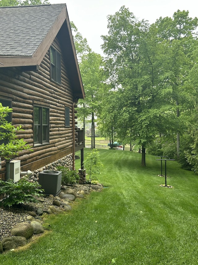 14278 Tyson Trl, Camden, MI 49232 - view of grassy yard featuring central air condition unit