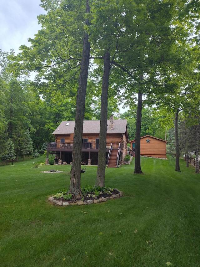 14278 Tyson Trl, Camden, MI 49232 - view of grassy yard featuring a wooden deck