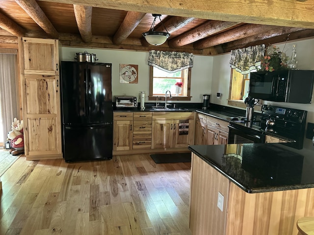14278 Tyson Trl, Camden, MI 49232 - kitchen with black appliances, a sink, wooden ceiling with exposed beams, light wood-style floors, and dark countertops