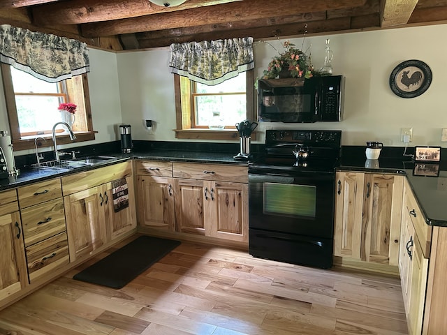 14278 Tyson Trl, Camden, MI 49232 - kitchen featuring black appliances, a sink, dark countertops, beam ceiling, and light wood-type flooring