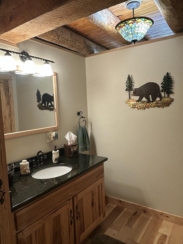 14278 Tyson Trl, Camden, MI 49232 - bathroom featuring wood finished floors, vanity, and baseboards