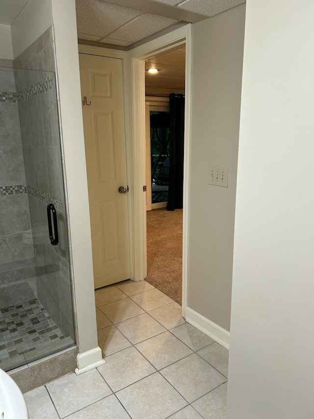 14278 Tyson Trl, Camden, MI 49232 - full bathroom with a stall shower, tile patterned floors, baseboards, and a paneled ceiling