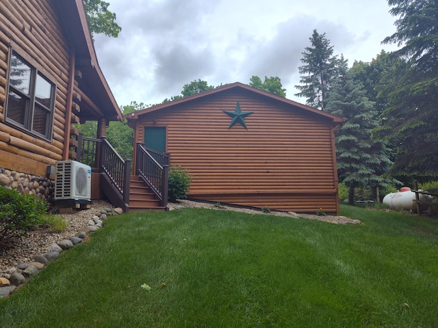 14278 Tyson Trl, Camden, MI 49232 - view of side of home featuring ac unit, faux log siding, and a lawn