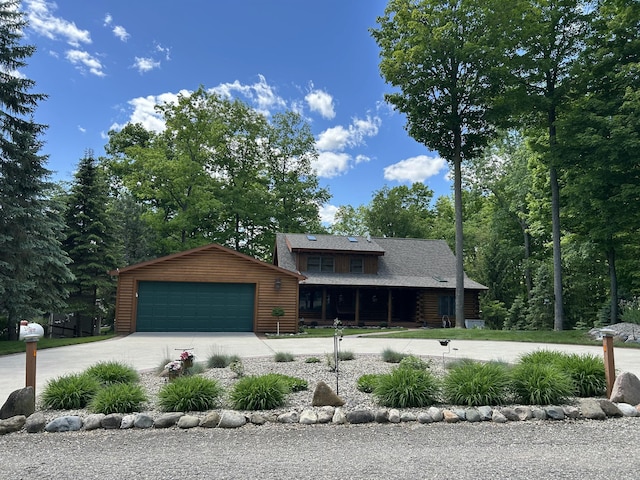 14278 Tyson Trl, Camden, MI 49232 - view of front of house featuring a garage and log siding