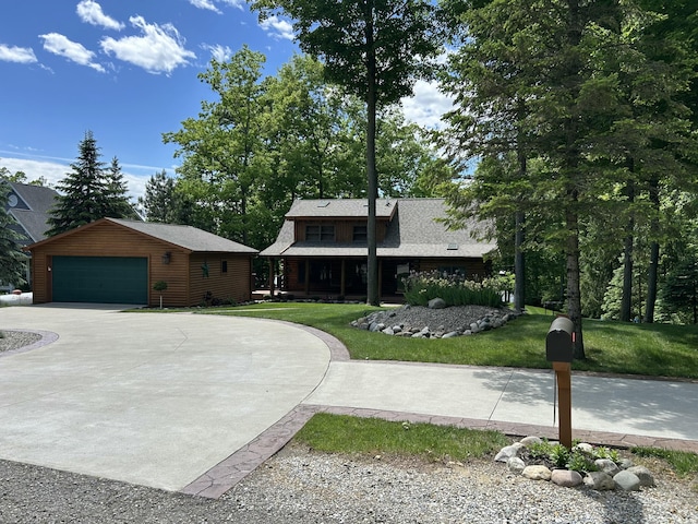 14278 Tyson Trl, Camden, MI 49232 - view of front of home with an outdoor structure, a front yard, and a garage