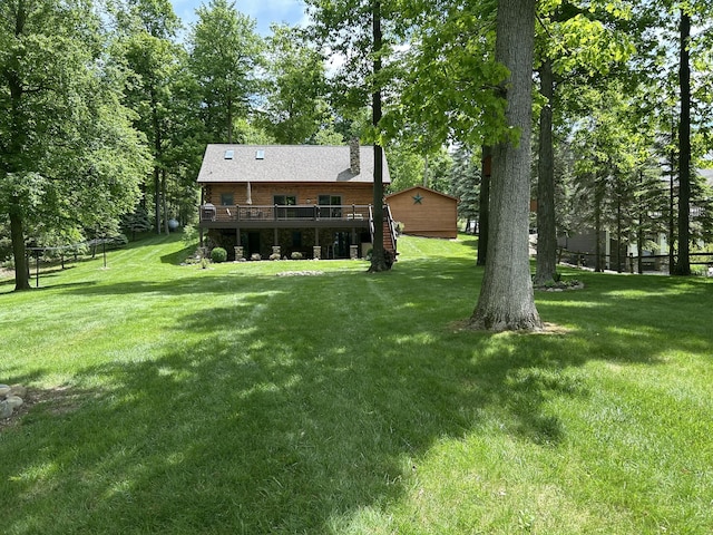 14278 Tyson Trl, Camden, MI 49232 - view of green lawn with a deck
