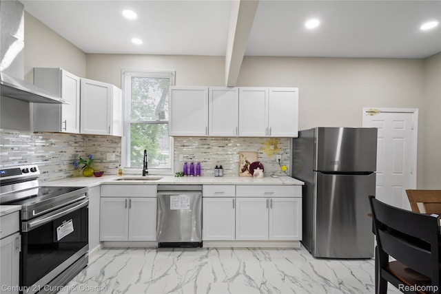 65 Melbourne St, Detroit, MI 48202 - kitchen with appliances with stainless steel finishes, wall chimney exhaust hood, a sink, light marble finish flooring, and recessed lighting