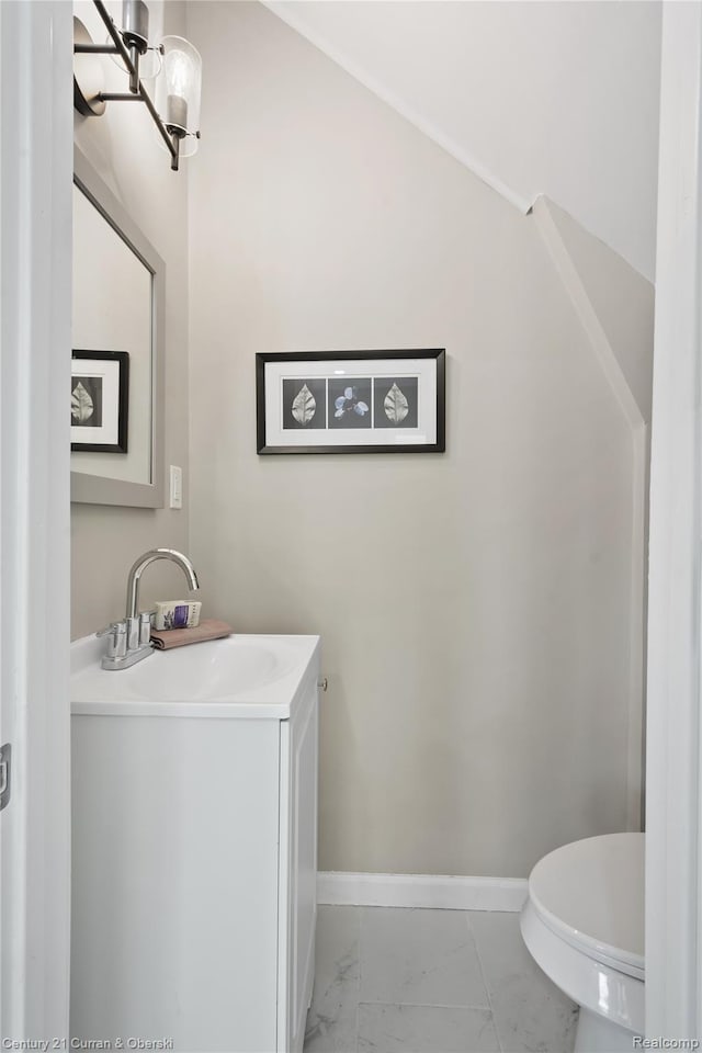 65 Melbourne St, Detroit, MI 48202 - half bath featuring vanity, marble finish floors, toilet, and baseboards