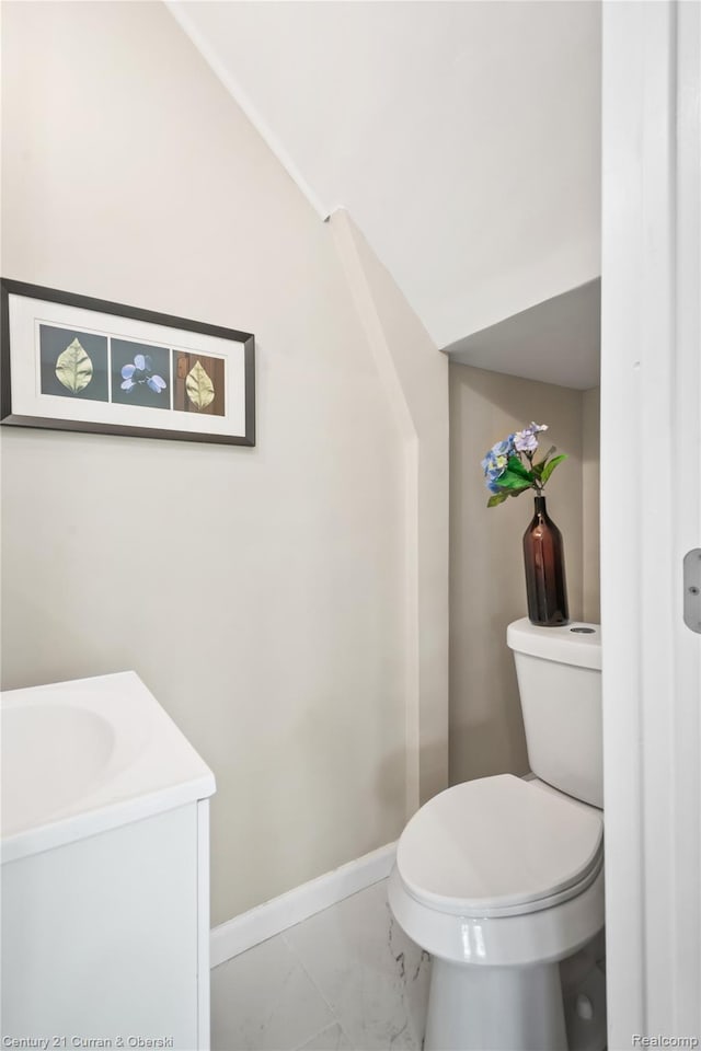 65 Melbourne St, Detroit, MI 48202 - bathroom featuring marble finish flooring, toilet, vanity, and baseboards