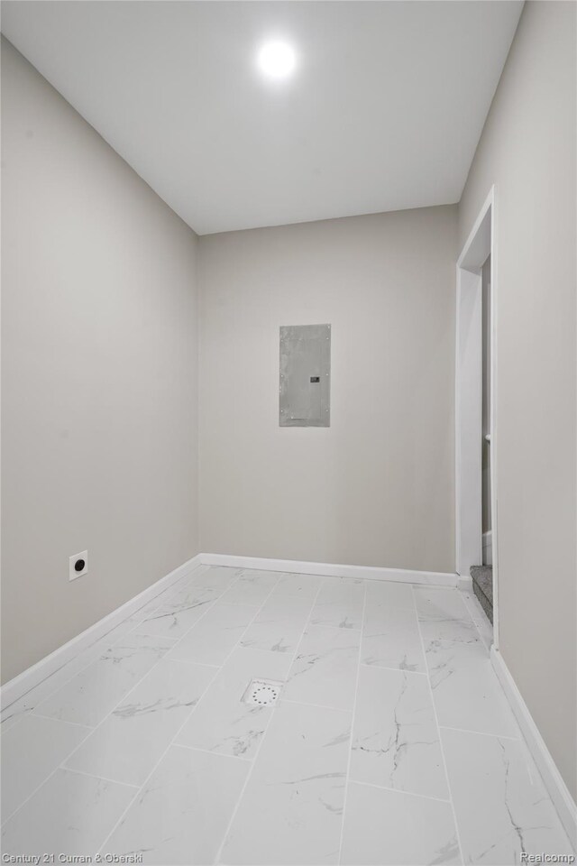 65 Melbourne St, Detroit, MI 48202 - unfurnished room featuring electric panel, light marble finish floors, and baseboards