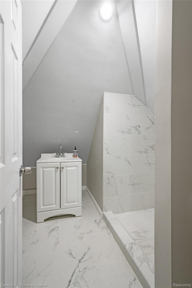 65 Melbourne St, Detroit, MI 48202 - full bath featuring marble finish floors, a shower stall, vanity, baseboards, and lofted ceiling