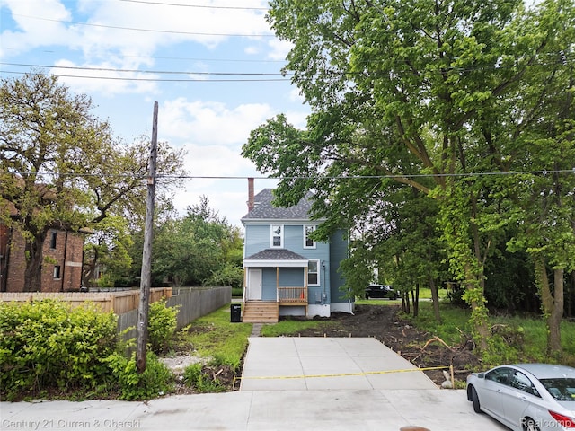 65 Melbourne St, Detroit, MI 48202 - view of front of property with a chimney and a shingled roof