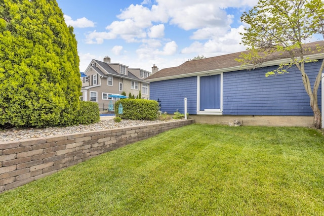 1406 W Washington Ave, Jackson, MI 49203 - rear view of house with a lawn