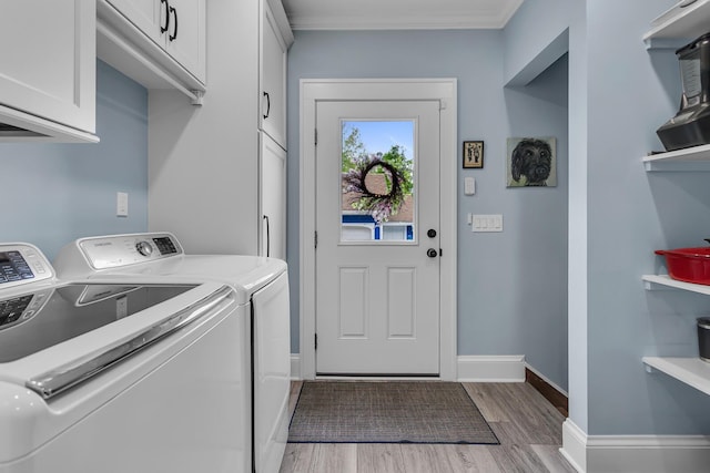 1406 W Washington Ave, Jackson, MI 49203 - laundry area with cabinet space, independent washer and dryer, light wood-style flooring, crown molding, and baseboards