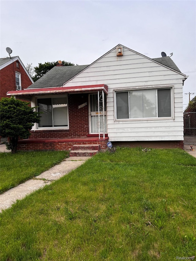 8208 Kentucky St, Detroit, MI 48204 - view of front of property with a front lawn and brick siding