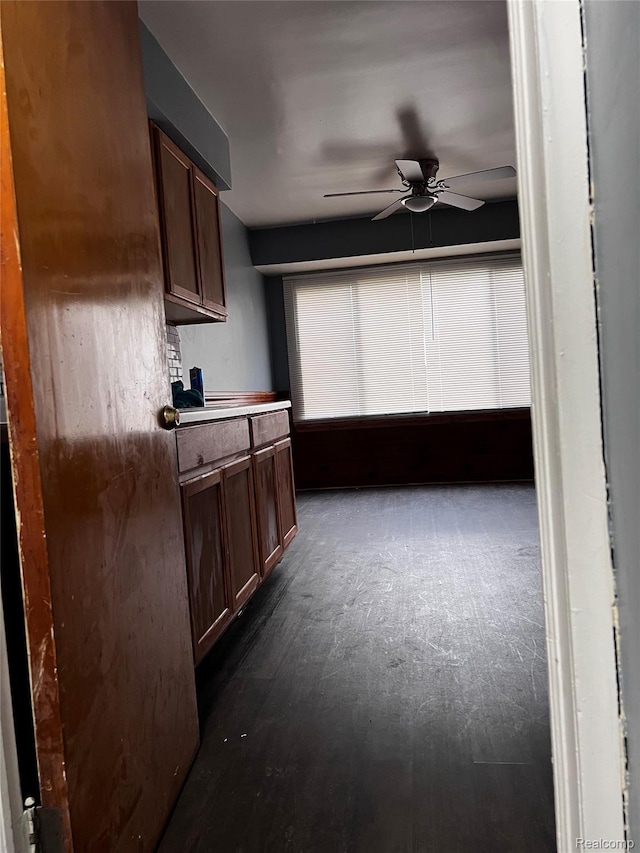 8208 Kentucky St, Detroit, MI 48204 - kitchen featuring a ceiling fan and dark brown cabinets