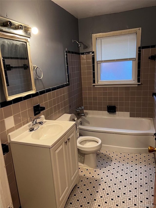 8208 Kentucky St, Detroit, MI 48204 - bathroom with tile walls, vanity, washtub / shower combination, tile patterned floors, and a wainscoted wall
