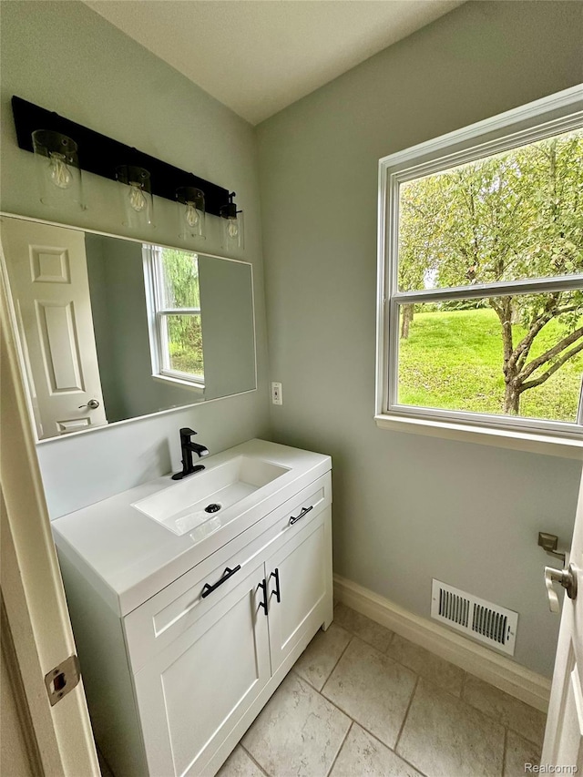 3758 Tienken Rd, Auburn Hills, MI 48326 - bathroom featuring vanity and baseboards