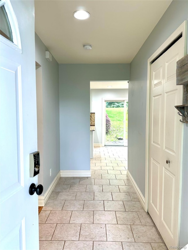 3758 Tienken Rd, Auburn Hills, MI 48326 - hallway featuring baseboards and light tile patterned floors