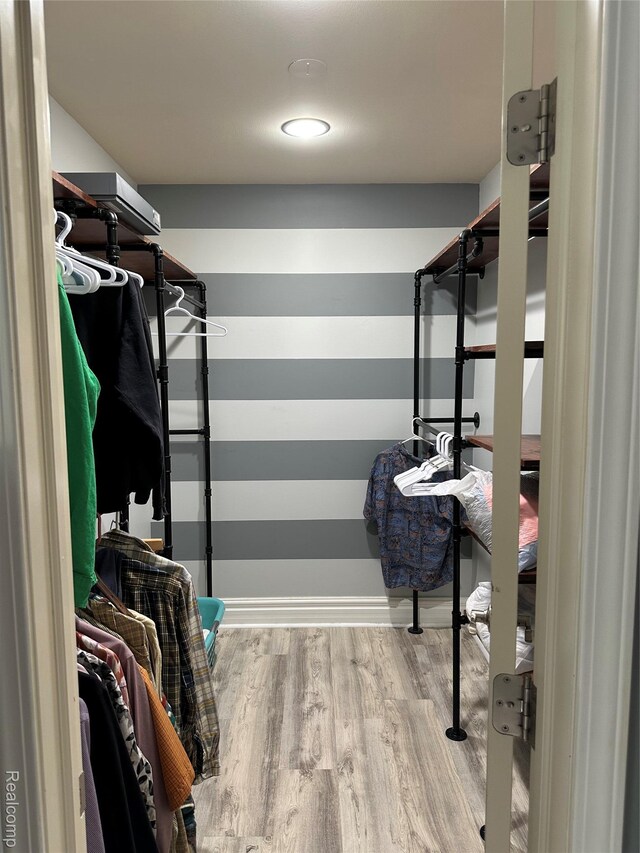3758 Tienken Rd, Auburn Hills, MI 48326 - spacious closet featuring wood finished floors