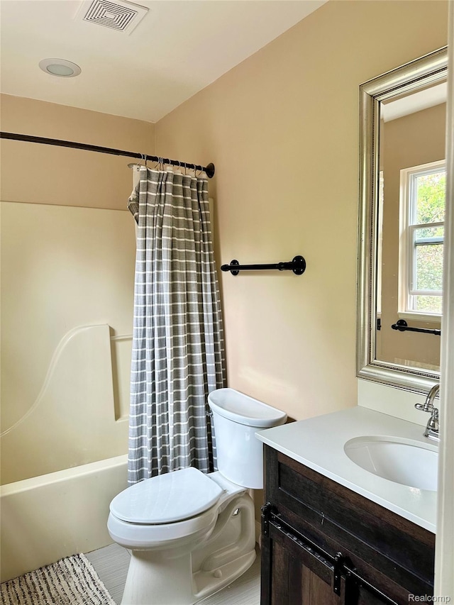 3758 Tienken Rd, Auburn Hills, MI 48326 - full bathroom featuring toilet, vanity, and shower / tub combo with curtain