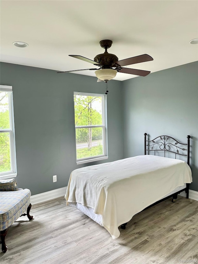 3758 Tienken Rd, Auburn Hills, MI 48326 - bedroom featuring baseboards, wood finished floors, and ceiling fan