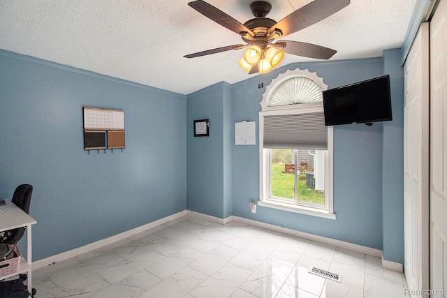 5315 Brown Rd, Millington, MI 48746 - empty room with marble finish floors, lofted ceiling, a ceiling fan, baseboards, and a textured ceiling