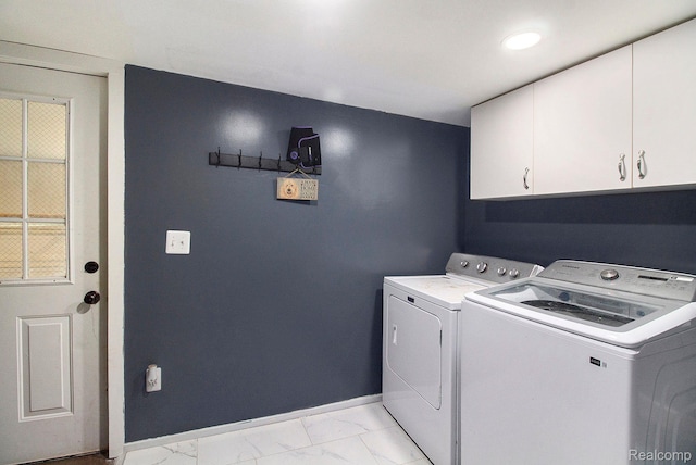 5315 Brown Rd, Millington, MI 48746 - laundry room featuring separate washer and dryer, light marble finish floors, cabinet space, and baseboards