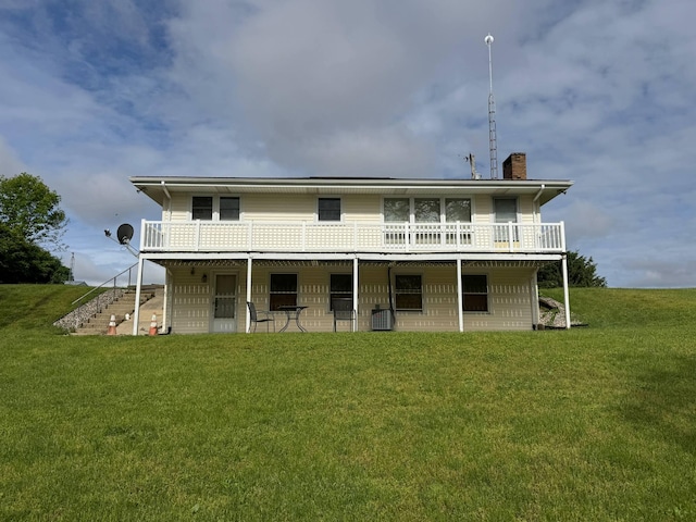 440 Pucker St, Niles, MI 49120 - back of house featuring a chimney, stairs, a deck, a lawn, and central AC