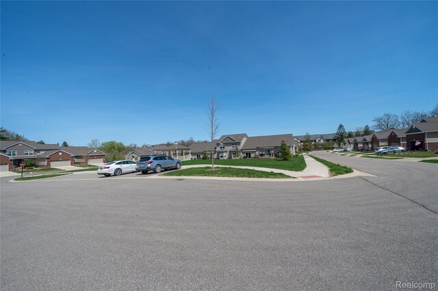 3021 Berkshire Rd, Auburn Hills, MI 48326 - view of asphalt street with a residential view and sidewalks